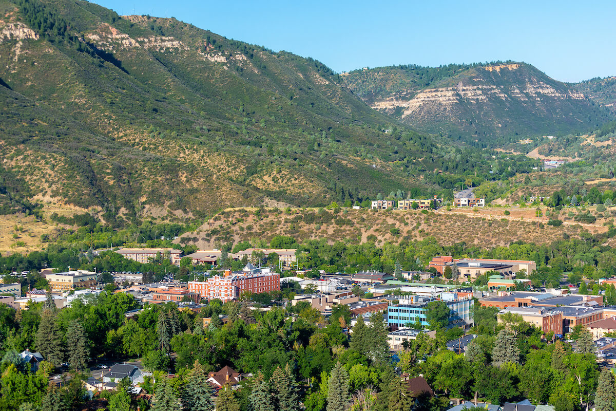 Durango neighborhoods nestled below green mesas in summer
