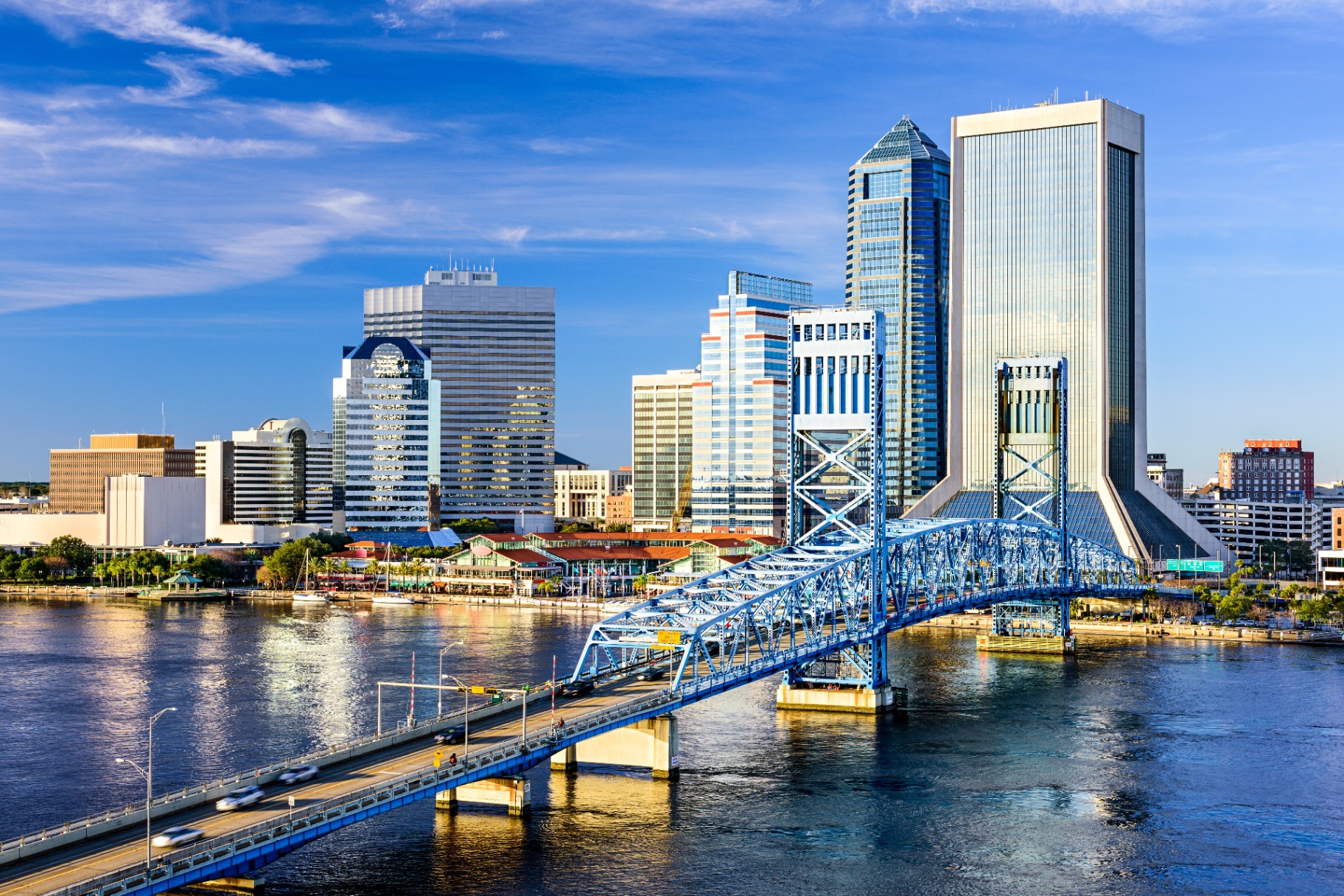 Jacksonville skyline with the blue Main Street Bridge crossing the St. Johns River on a sunny day